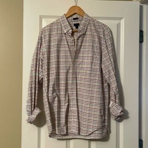 White background with blue red navy yellow stripes which form small squares